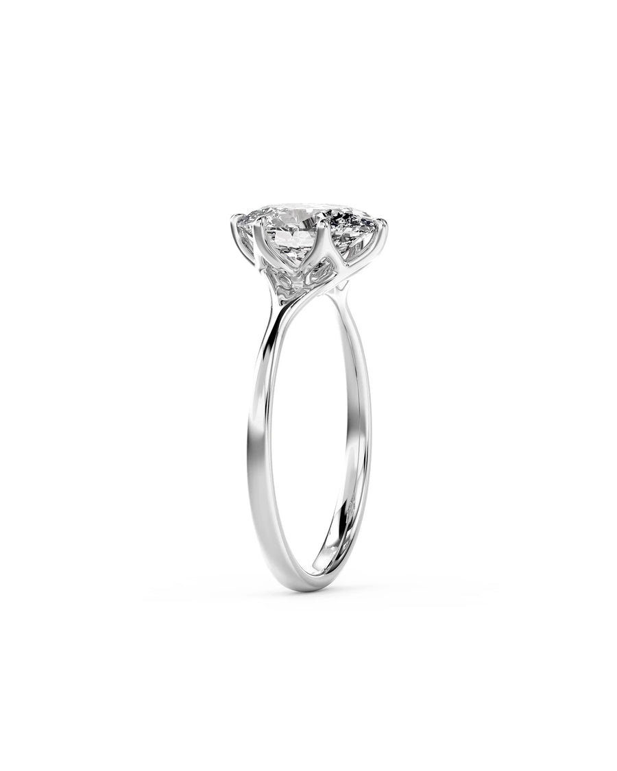 Oval cut diamond engagement ring in polished white gold with a tulip-style claw setting.