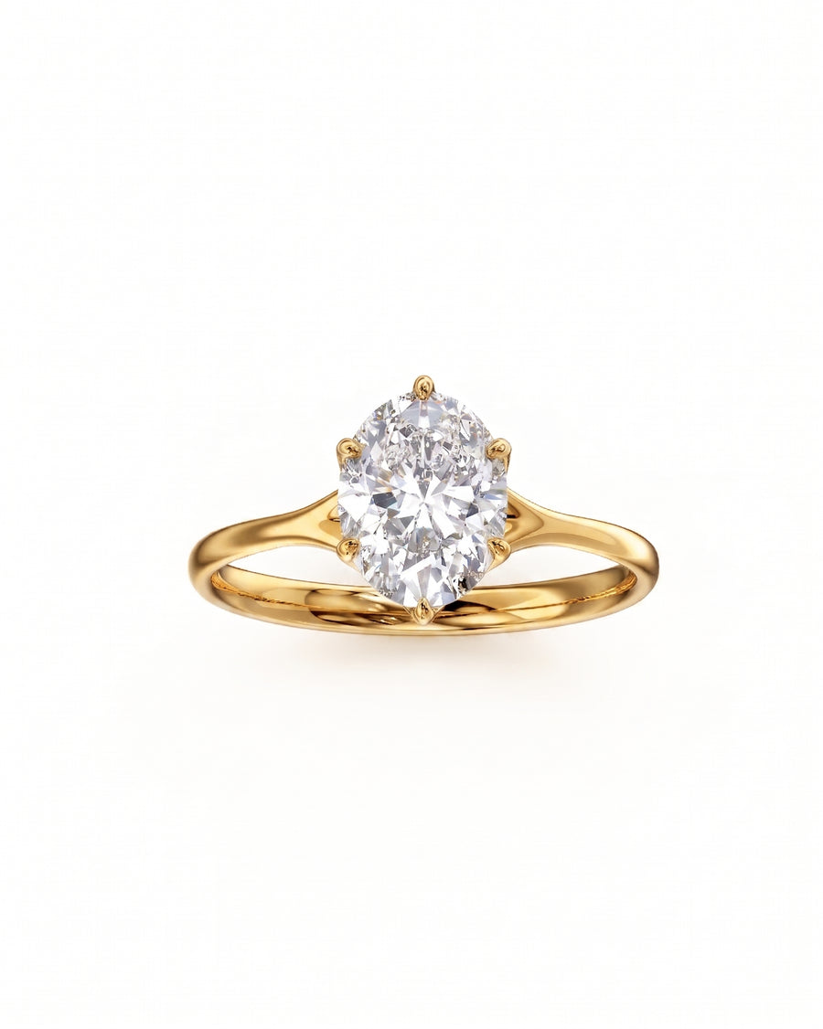 Oval cut diamond engagement ring with a tulip claw setting in polished yellow gold.