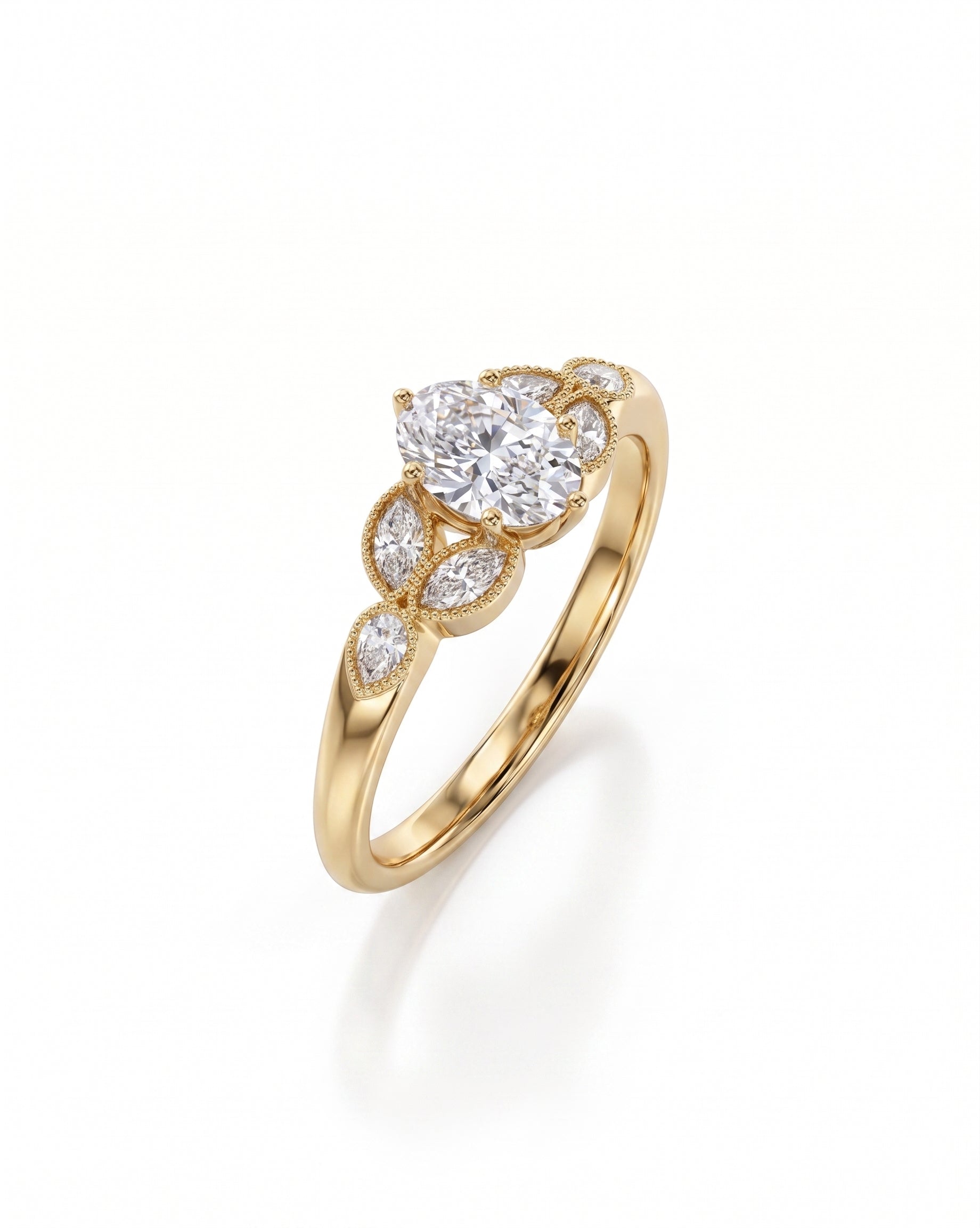 Gold engagement ring with an oval cut diamond and marquise side stones.