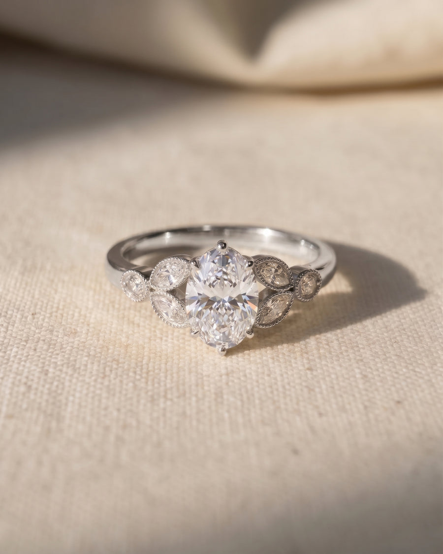 Platinum oval cut vintage engagement ring with lab grown diamonds.