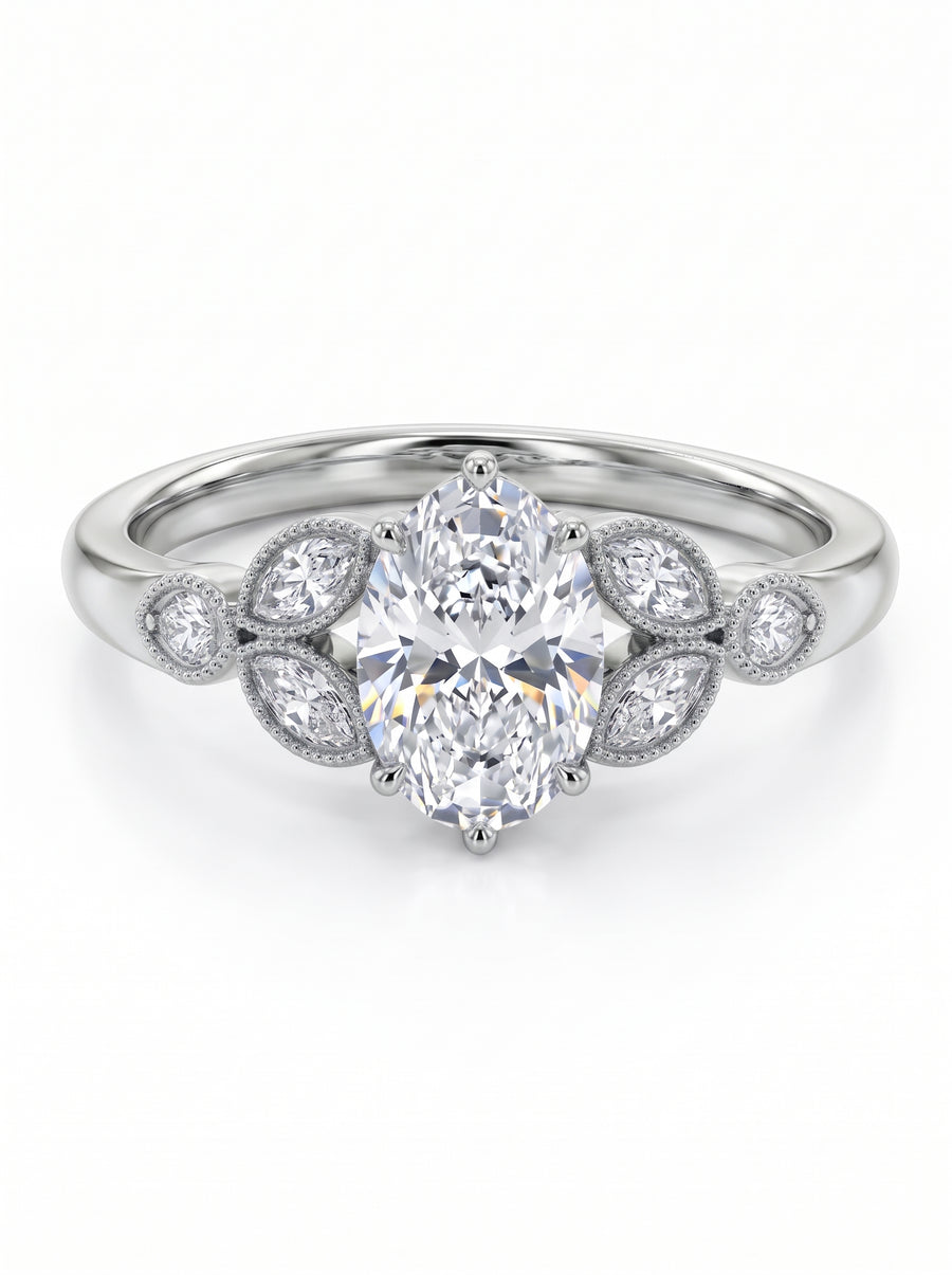 Oval cut diamond engagement ring in platinum with marquise and round side stones in a vintage milgrain setting.