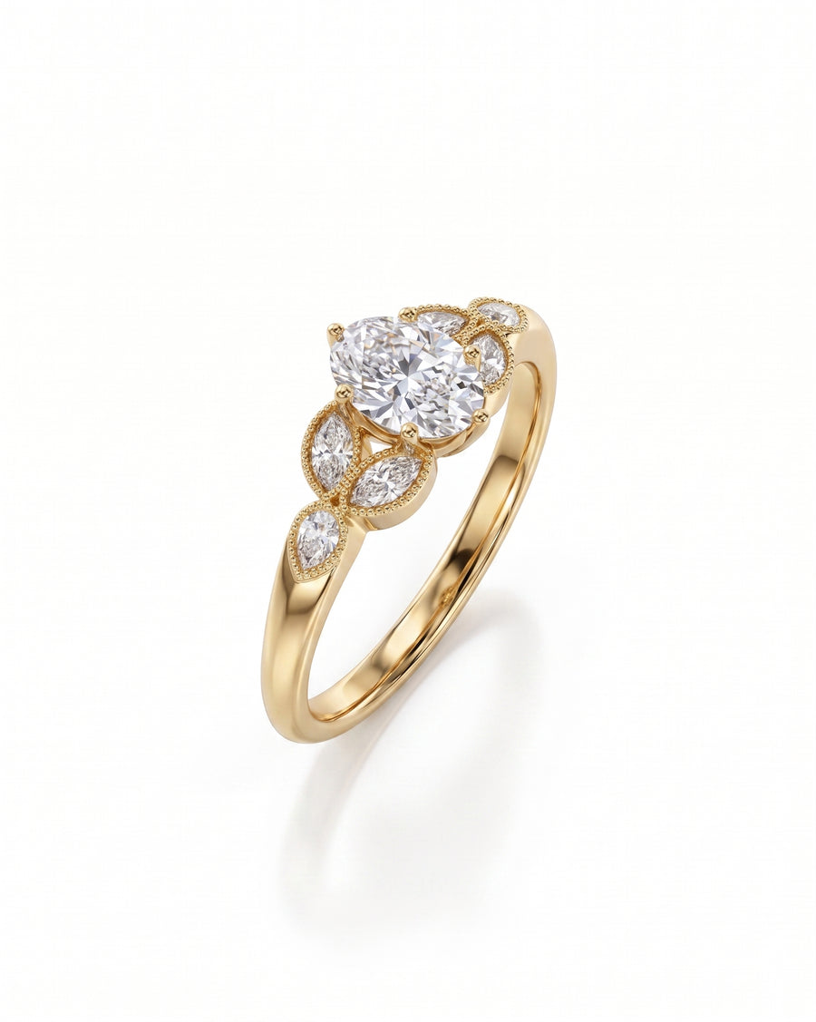 Oval cut diamond engagement ring in yellow gold with marquise and round side stones on a white background.