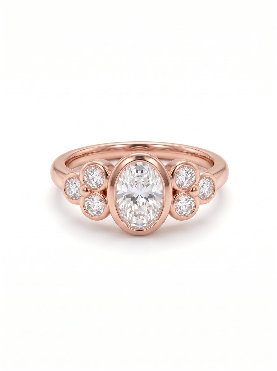 Oval diamond engagement ring in 18ct rose gold with a trefoil cluster design on a white background.