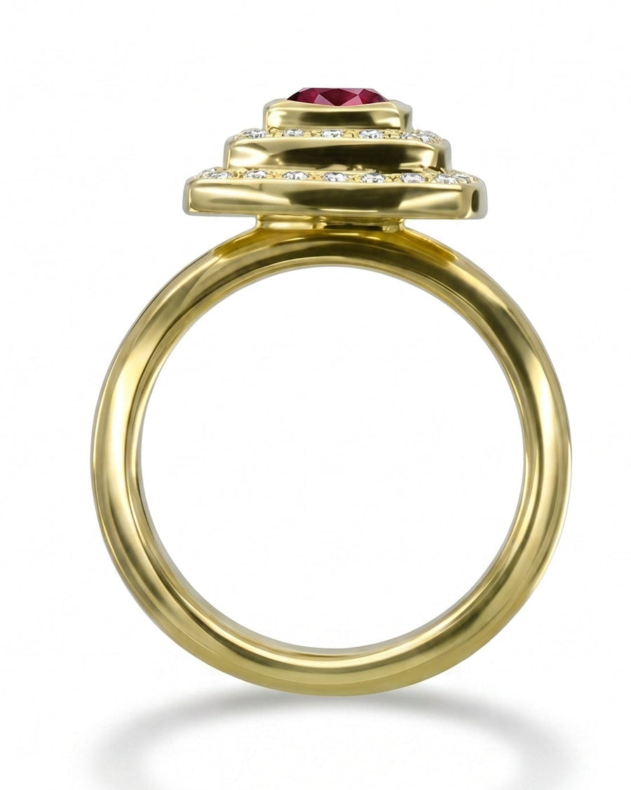 Yellow gold cluster engagement ring with a ruby and diamonds.