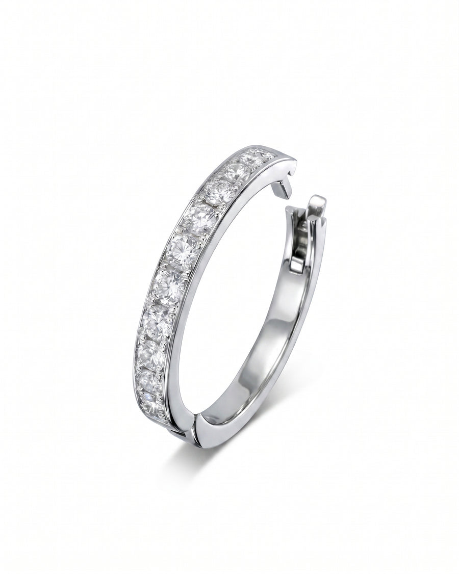 Silver hinged ring with pavé diamonds.