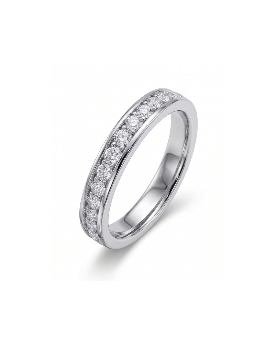 Platinum pavé diamond ring with a single row of round brilliant diamonds.