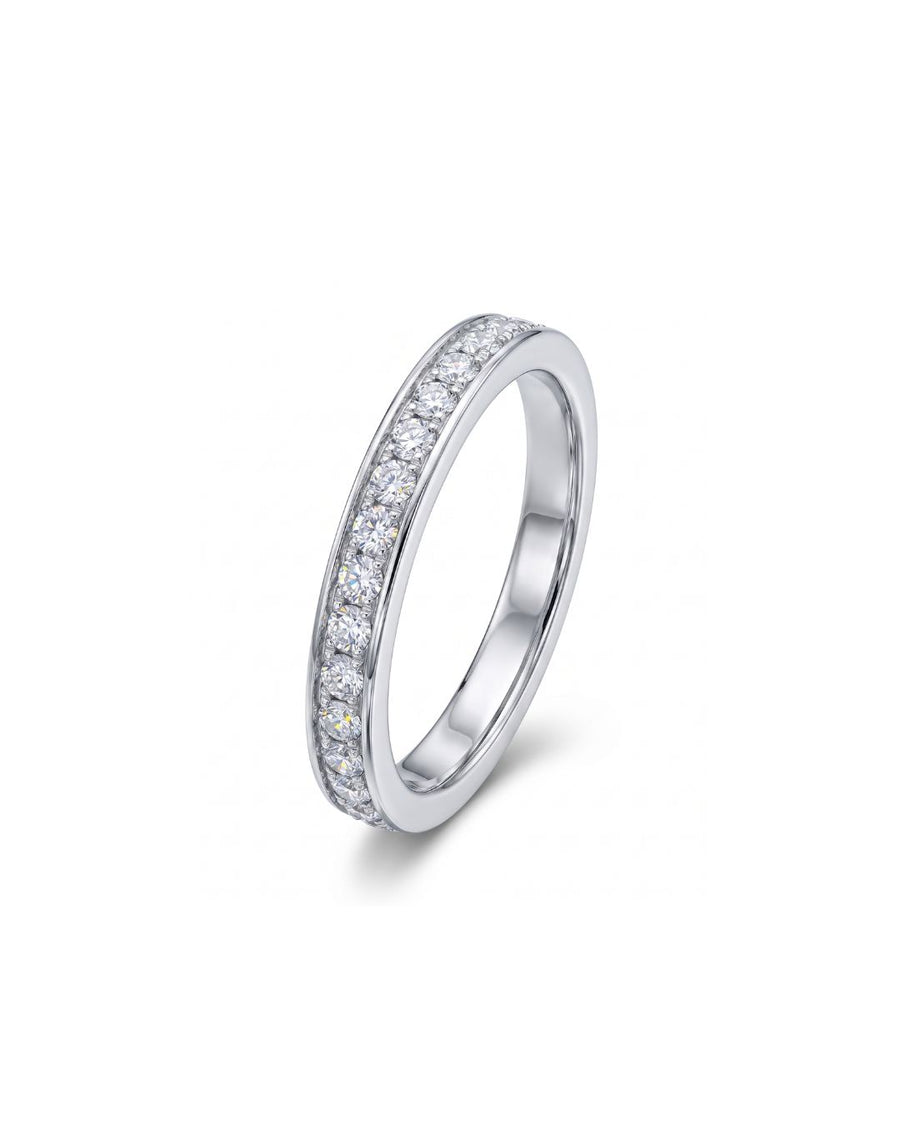 White gold pavé diamond ring with a single band of round diamonds.