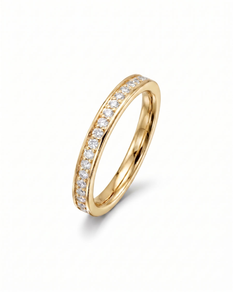 Gold band ring with pavé diamonds.