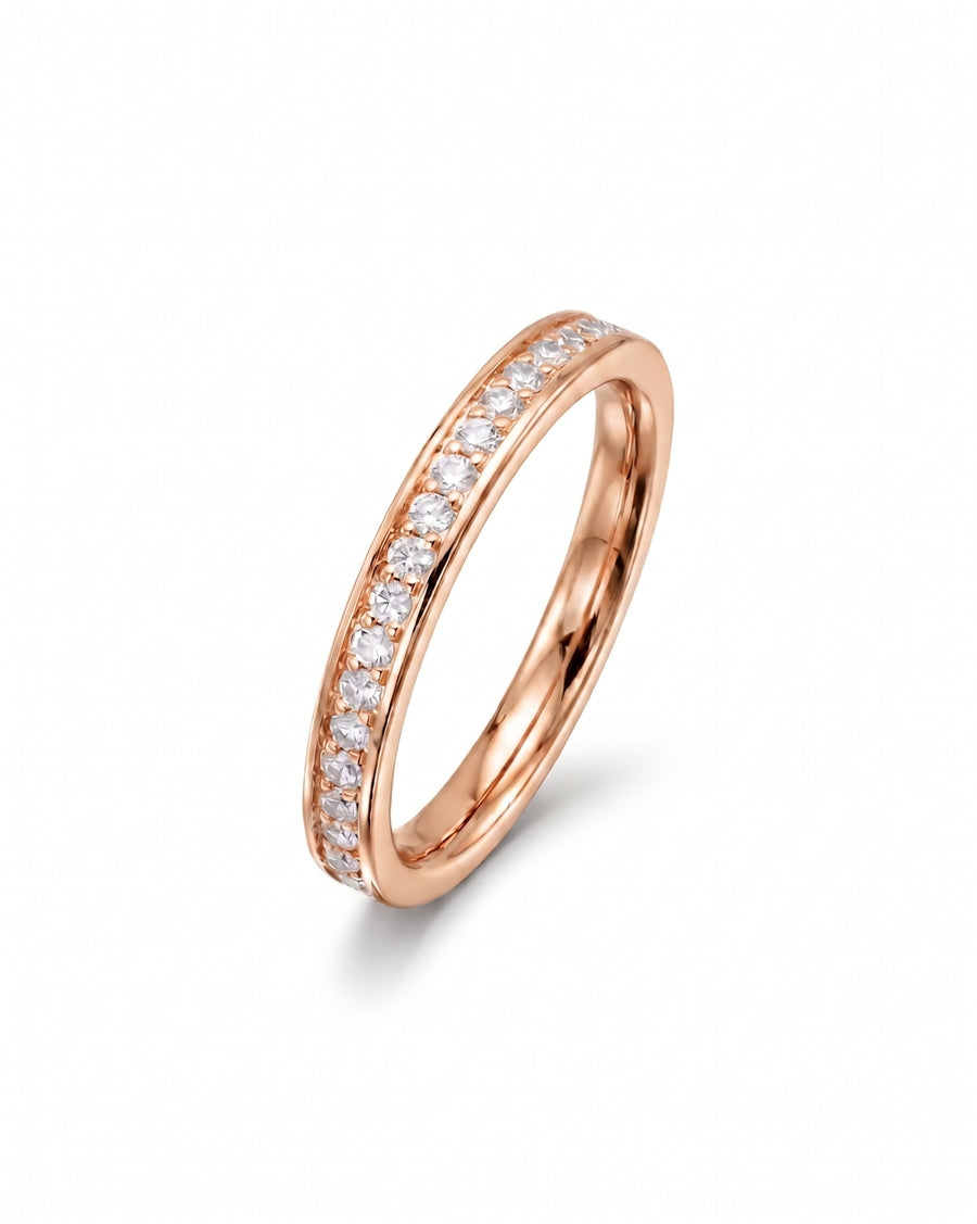 Rose gold pavé diamond ring with a single row of round diamonds.