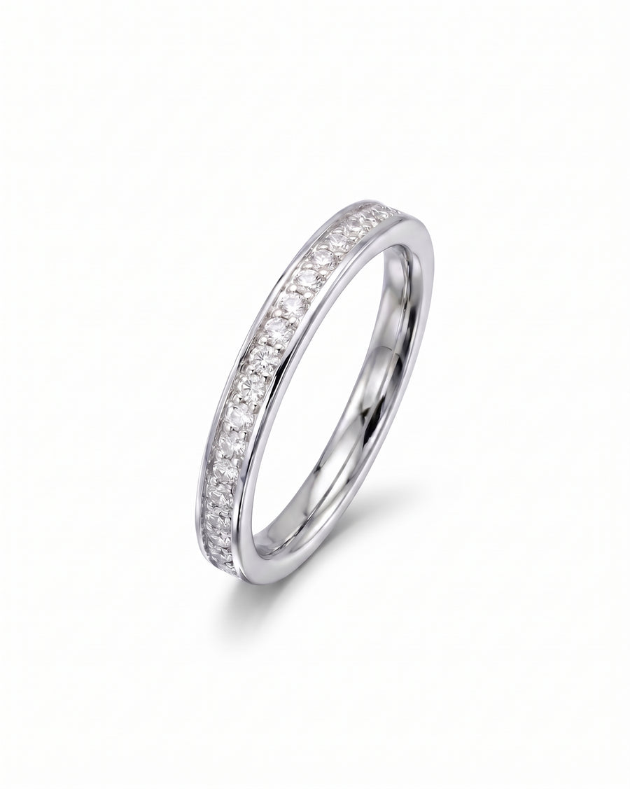 Silver pavé diamond ring with a single row of gemstones.