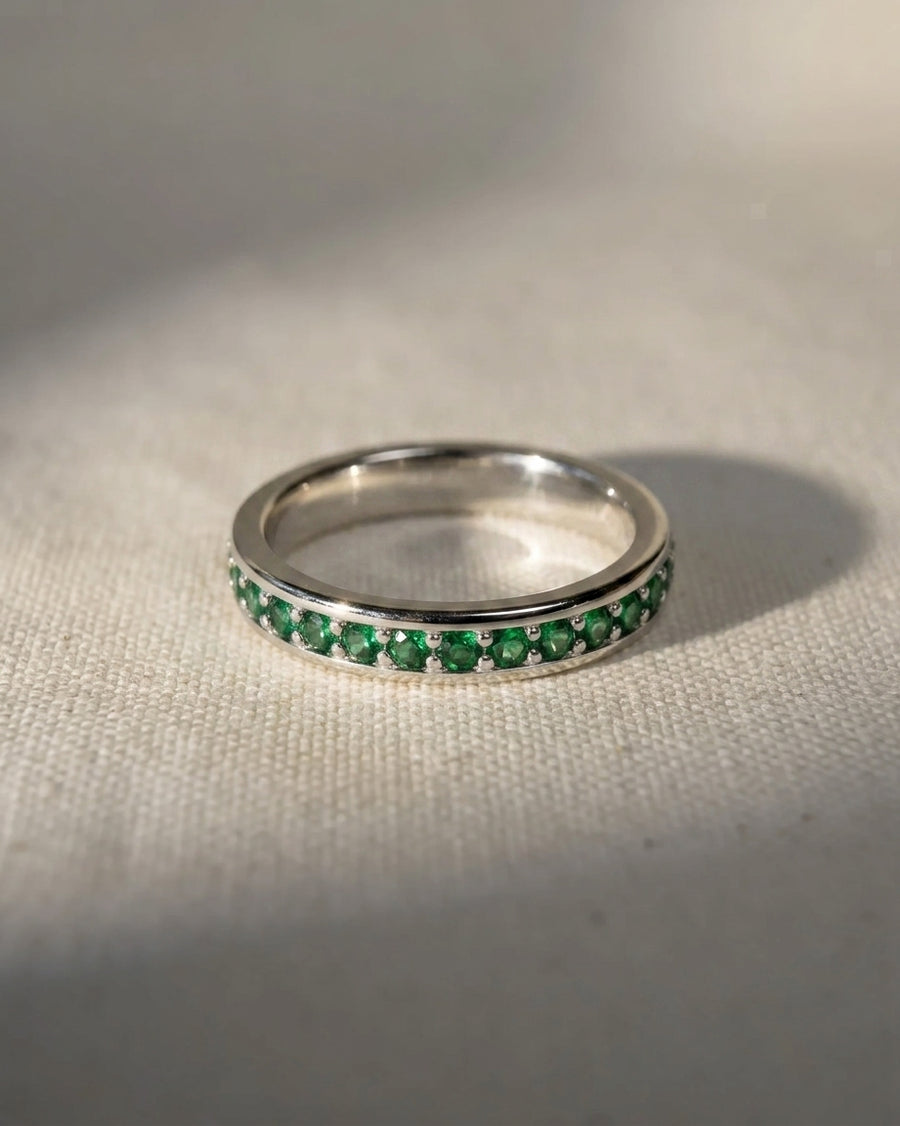 Platinum ring with pavé green diamonds.