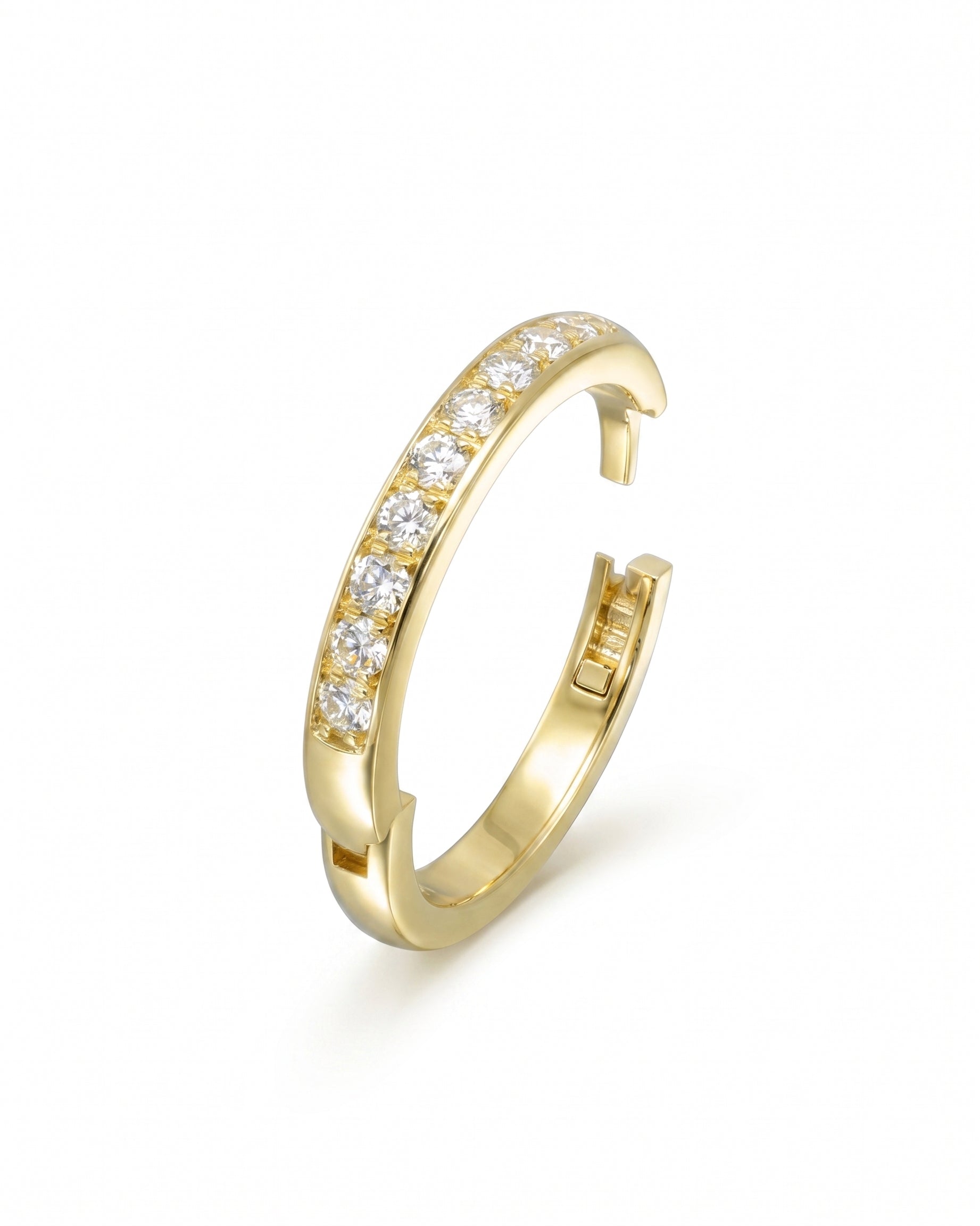 Gold pavé hinged ring with a row of clear gemstones.