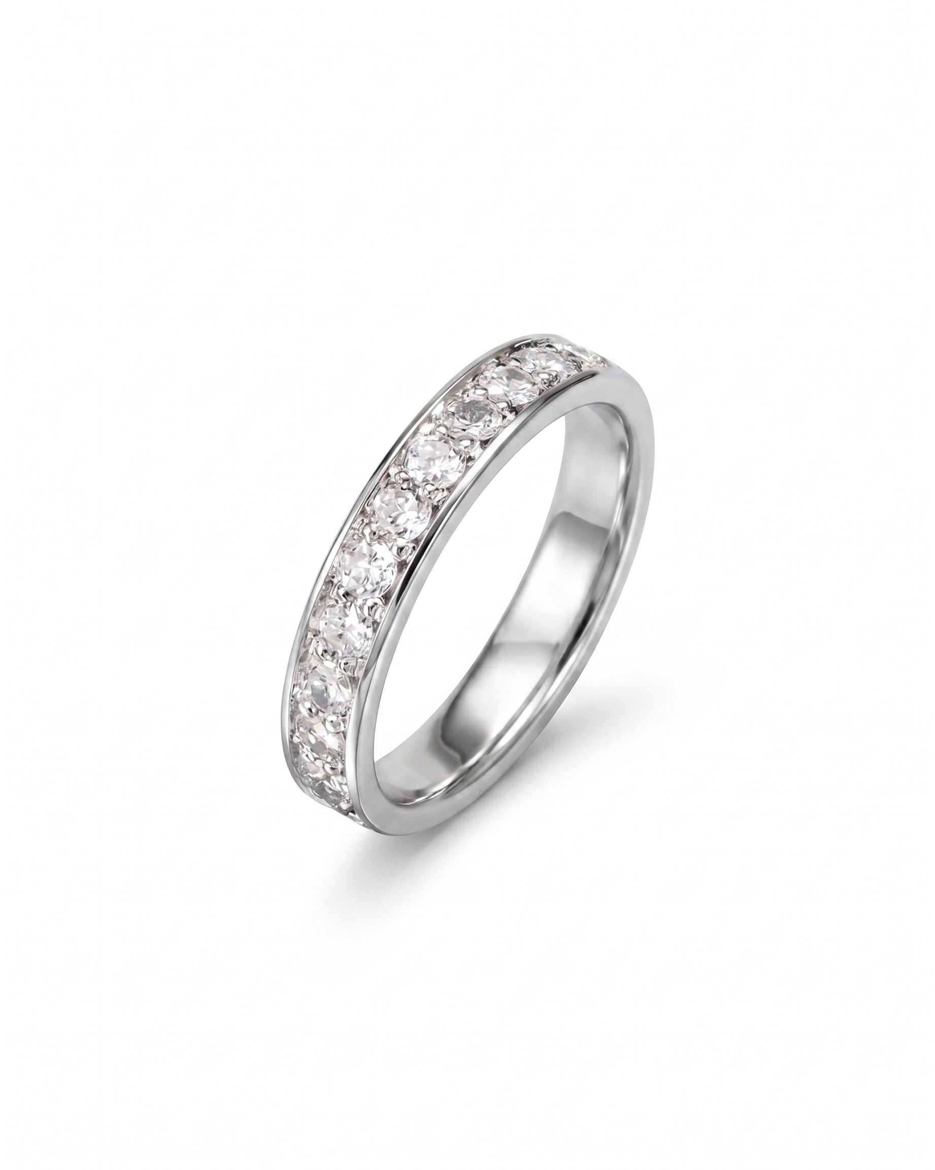 Pavé platinum ring with a band of round diamonds.