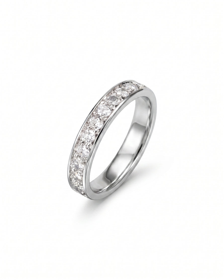 Pavé platinum ring with a band of round diamonds.