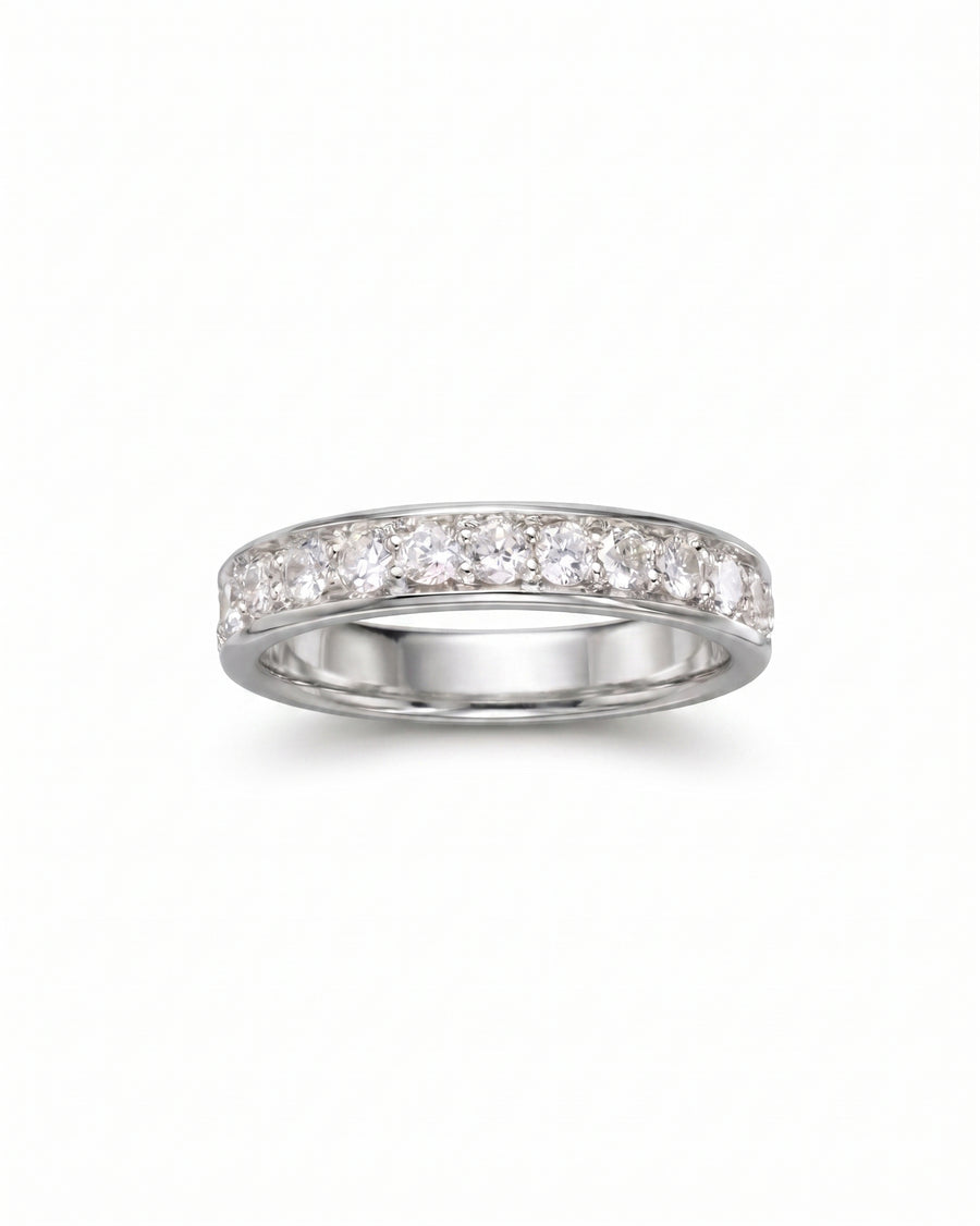 Pavé platinum and diamond ring with a row of round diamonds.