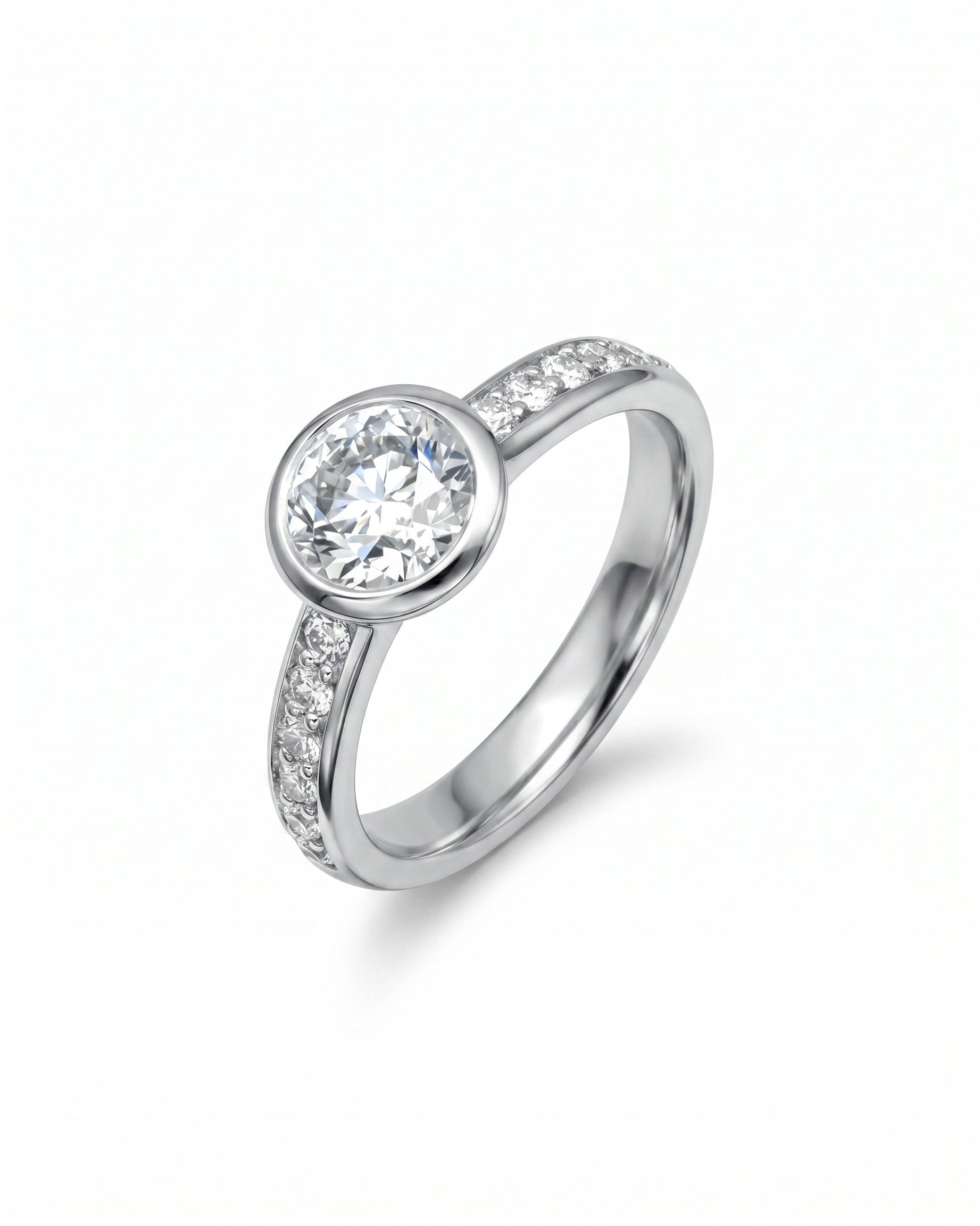 Silver pavé rub over diamond engagement ring with a round center stone.