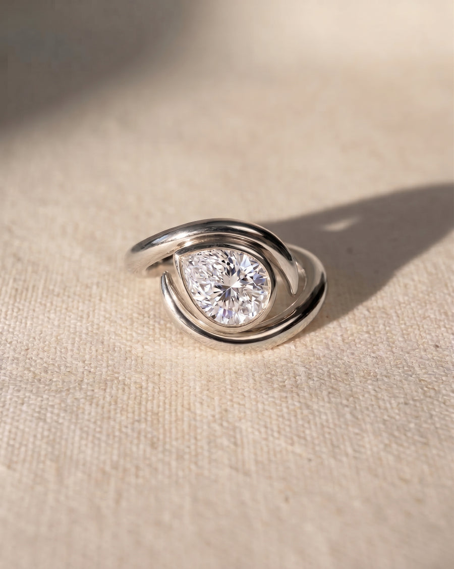 Platinum pear cut spiky engagement ring with a 1ct lab grown diamond.
