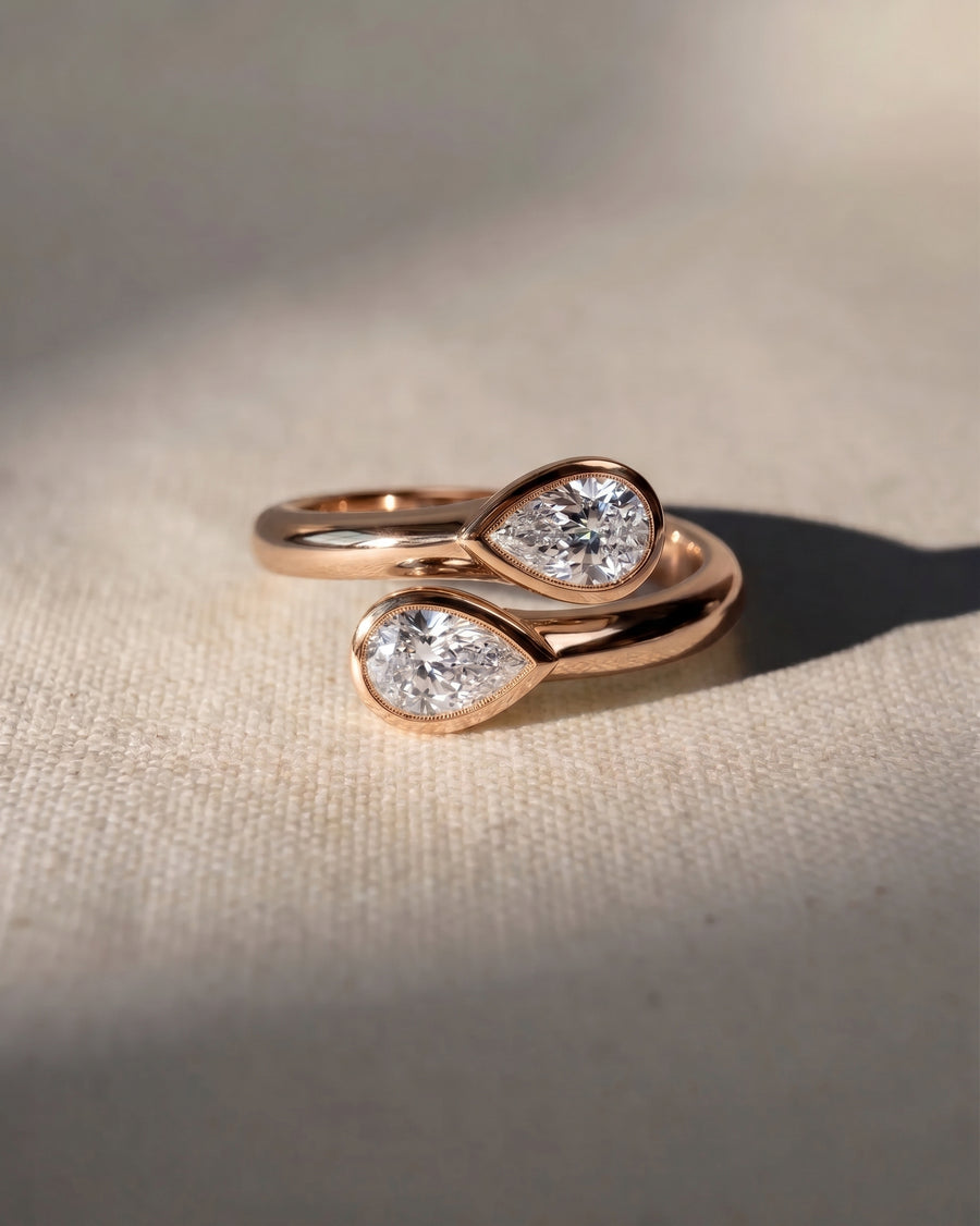 18ct rose gold pear cut toi et moi engagement ring with two diamonds.