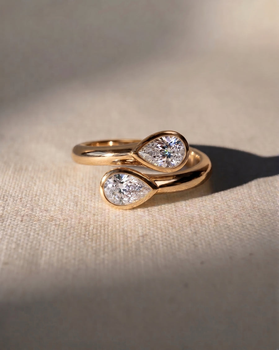 18ct yellow gold toi et moi ring with two pear cut diamonds.