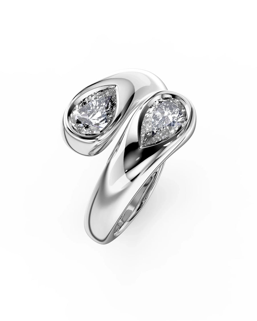 Silver pear cut toi et moi engagement ring with two diamonds.