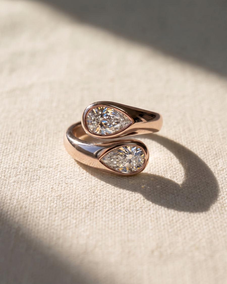 Rose gold toi et moi ring with two pear cut lab grown diamonds.