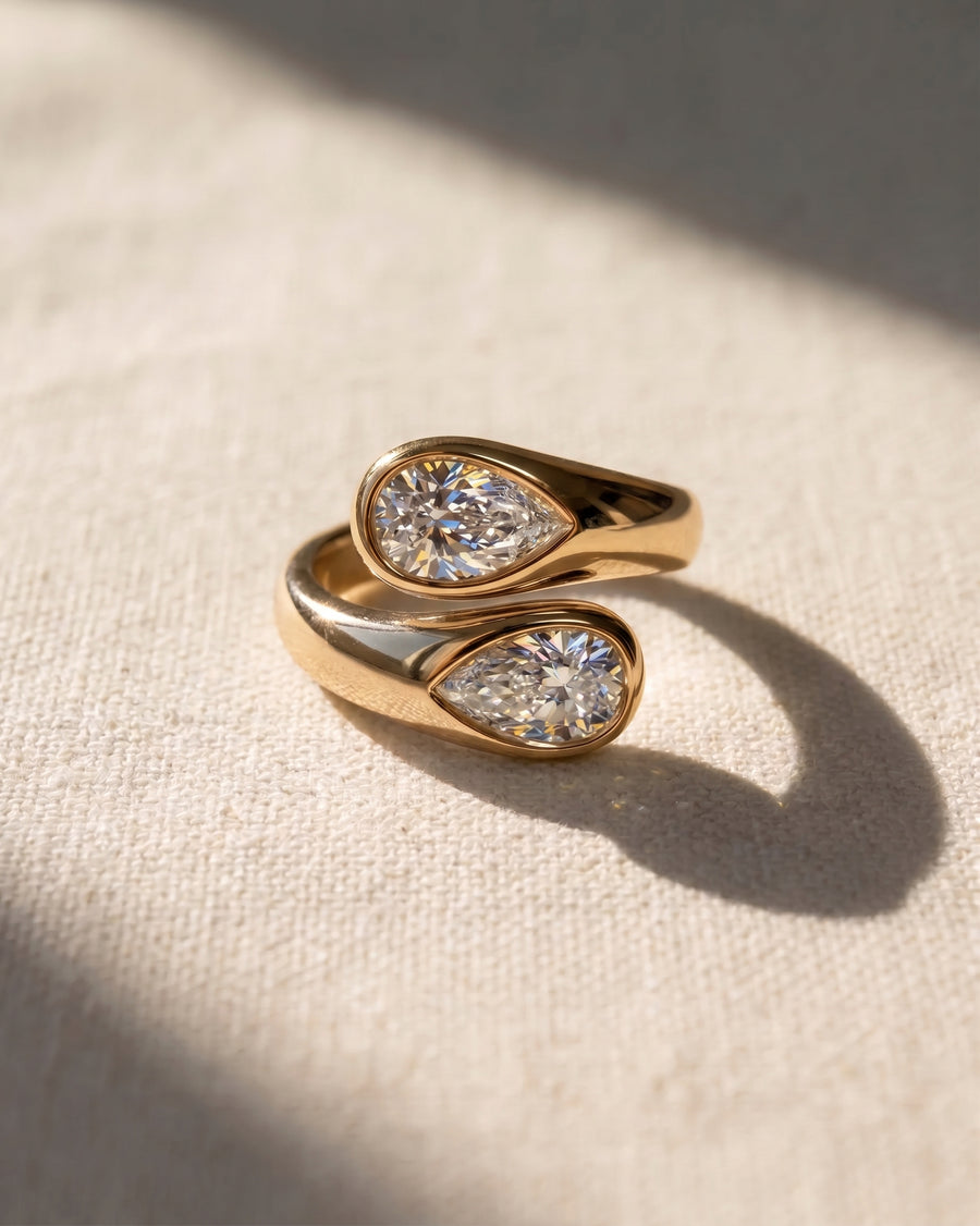 18ct yellow gold toi et moi ring with two pear-cut lab grown diamonds.