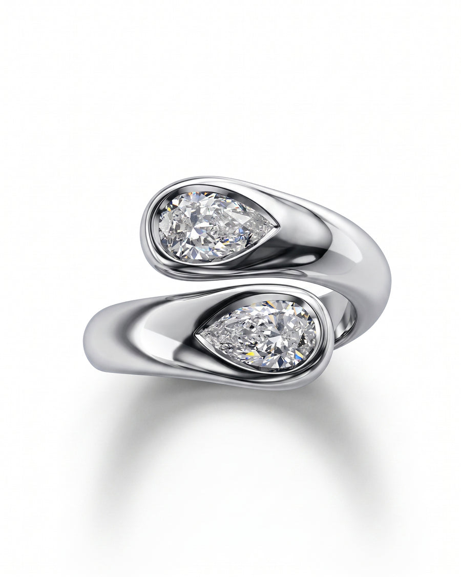 Silver toi et moi ring with two pear cut diamonds.
