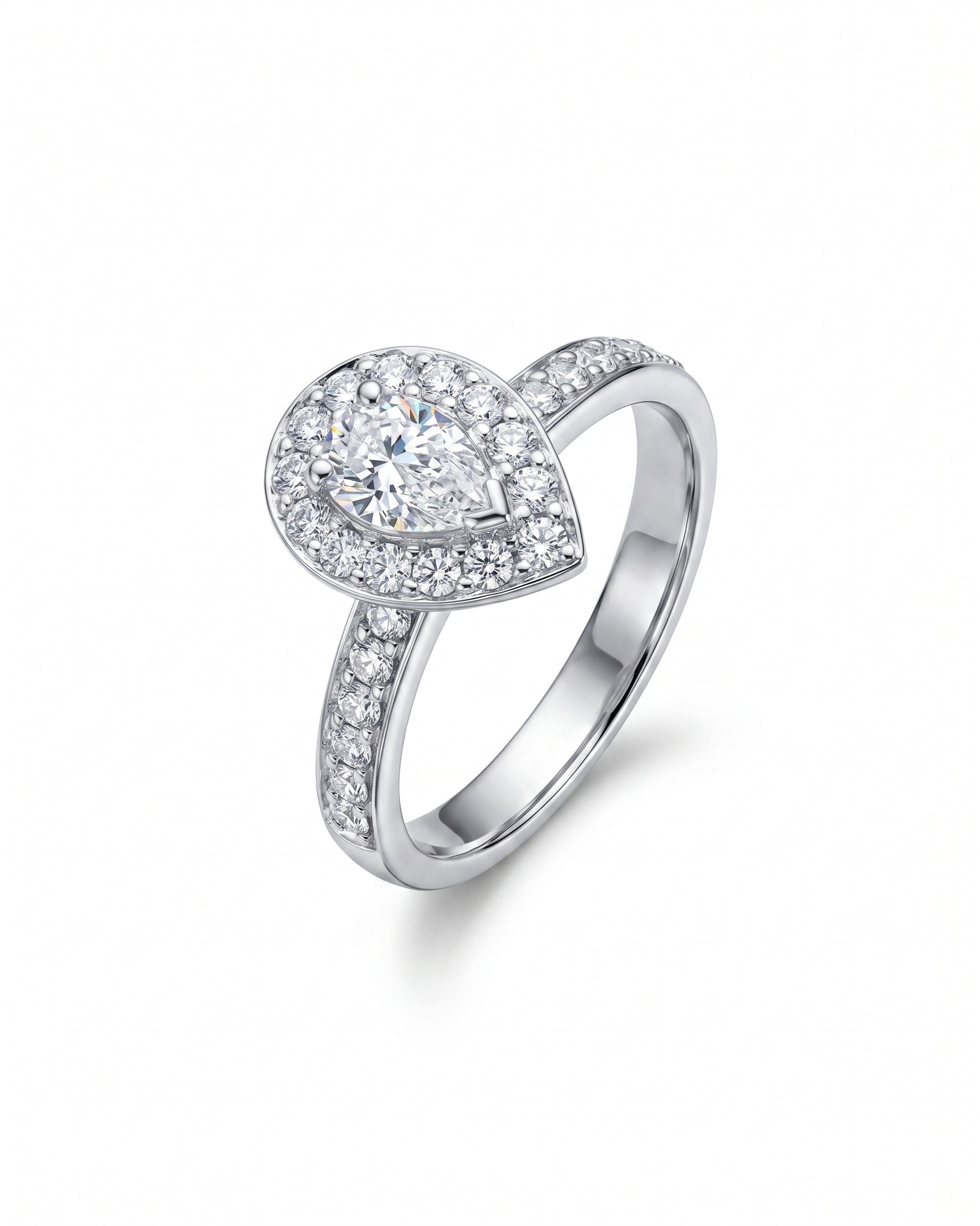 White gold engagement ring with a pear-shaped diamond cluster.