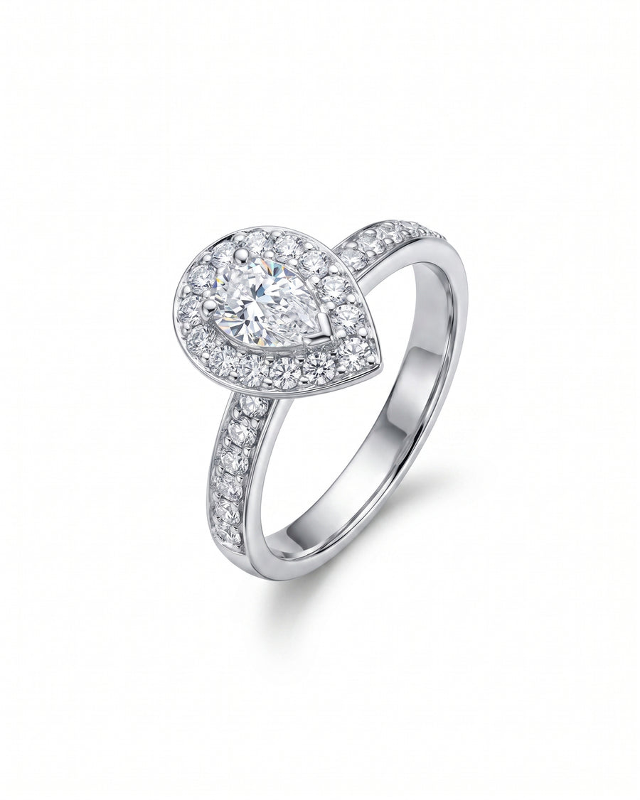 White gold engagement ring with a pear-shaped diamond cluster.