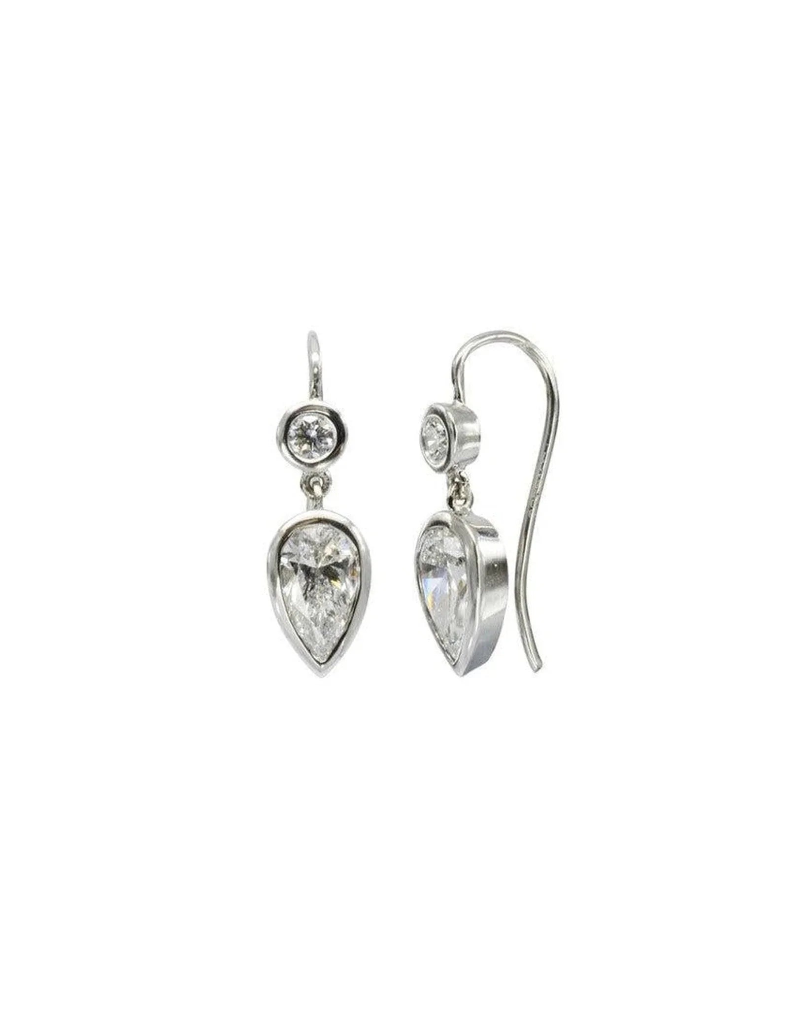 White gold drop earrings with round and pear shaped diamonds.