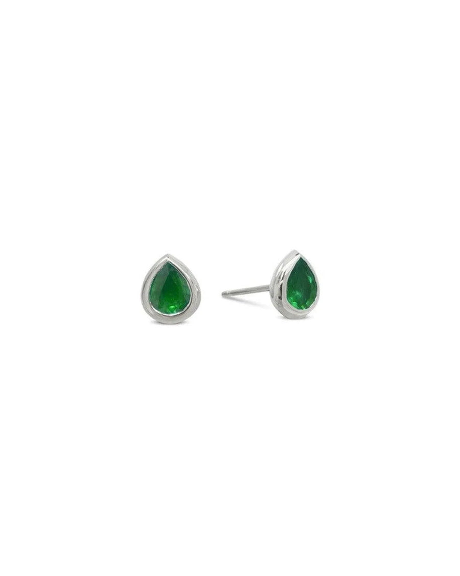 Pear-shaped emerald stud earrings set in gold on white background