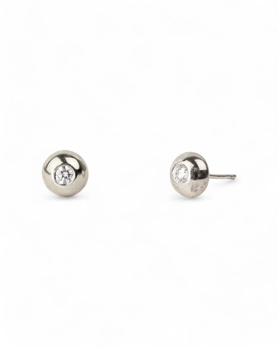 white gold diamond stud earrings with organic rounded pebble shape on white background