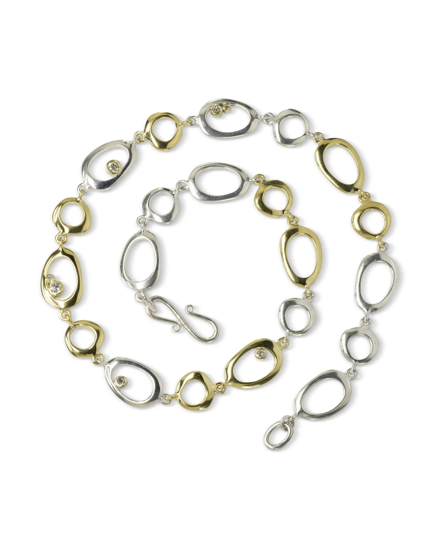 Organic pebble-shaped gold and silver necklace with diamonds, handmade luxury jewelry