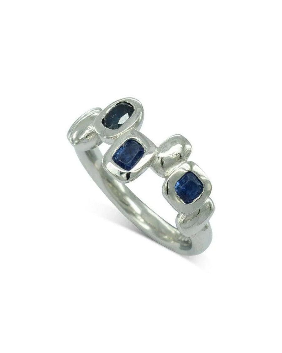 9ct gold half eternity ring with organic bezel-set blue sapphires