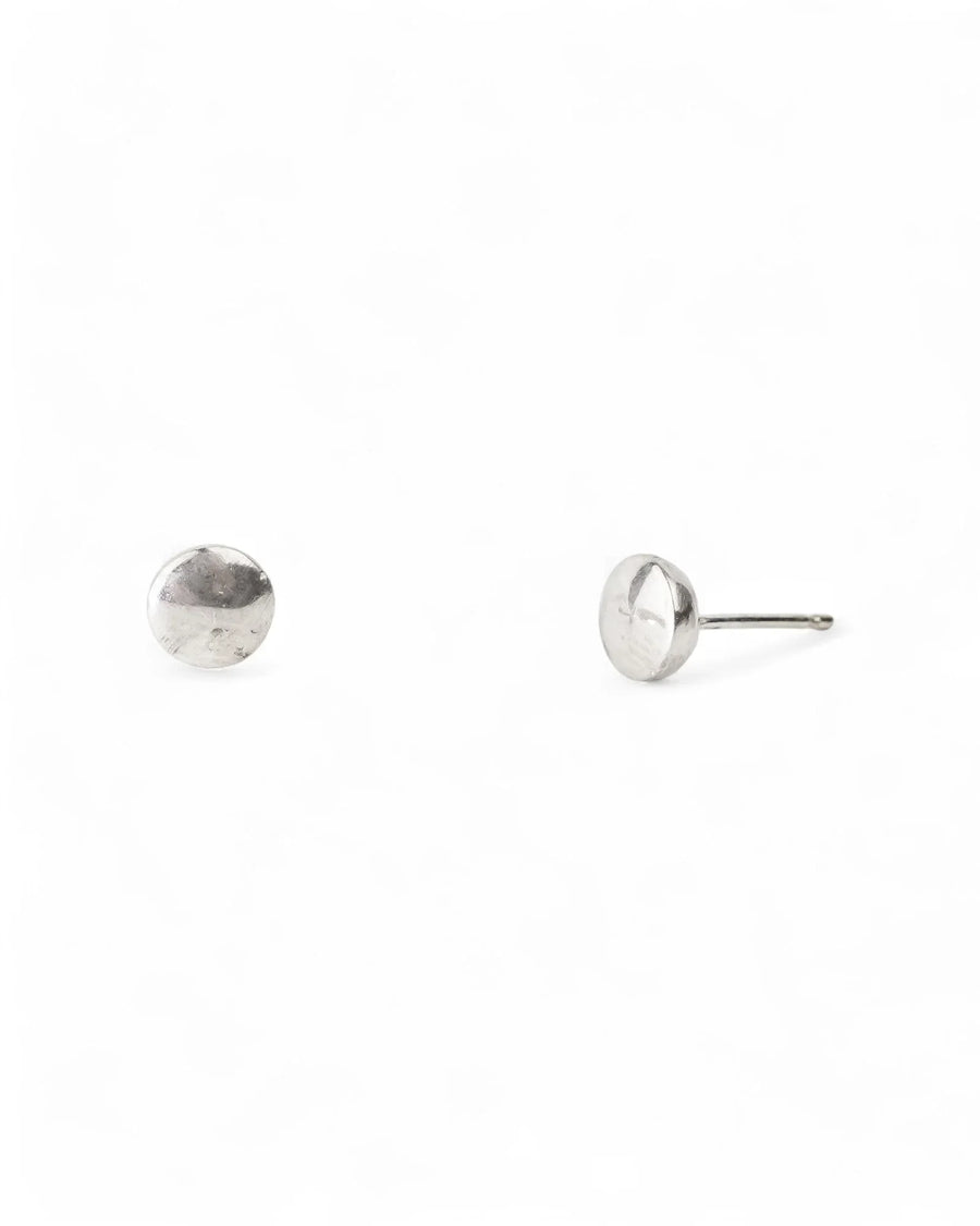Handcrafted silver pebble stud earrings with an organic, textured finish on white background