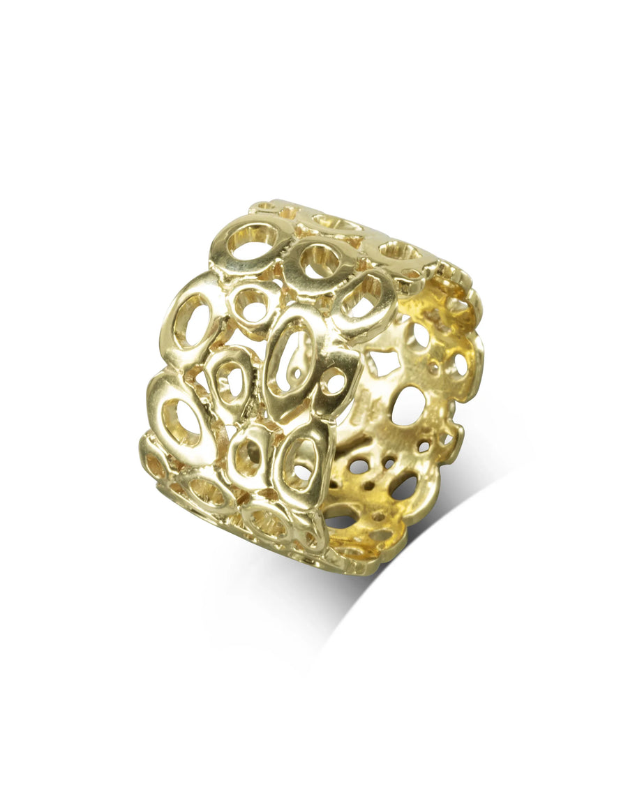 Gold pebble wedding ring with an organic, openwork design.