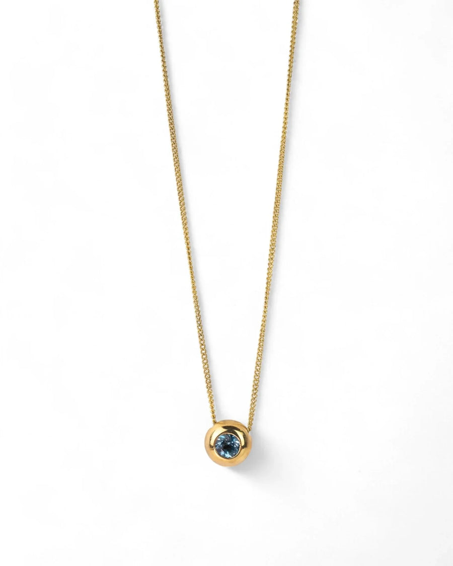 Yellow gold pendant necklace with round aquamarine gemstone on a simple chain