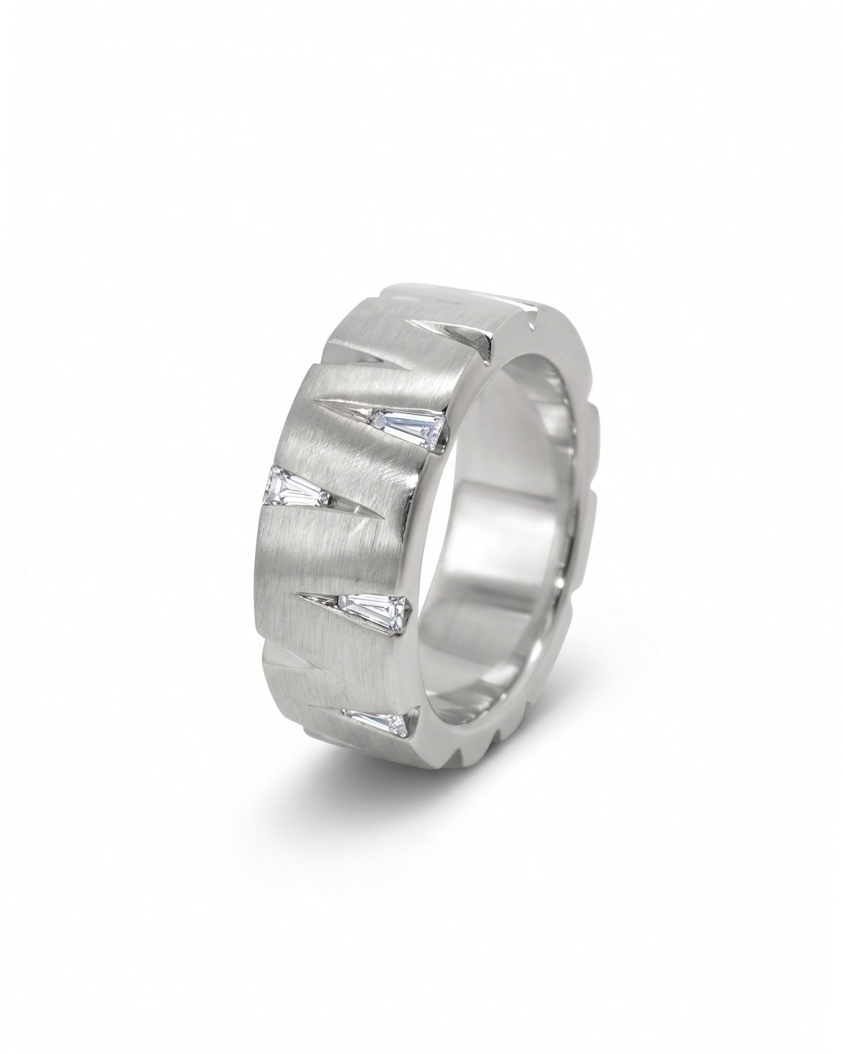 Brushed platinum band ring featuring triangular cutouts with inset baguette diamonds.