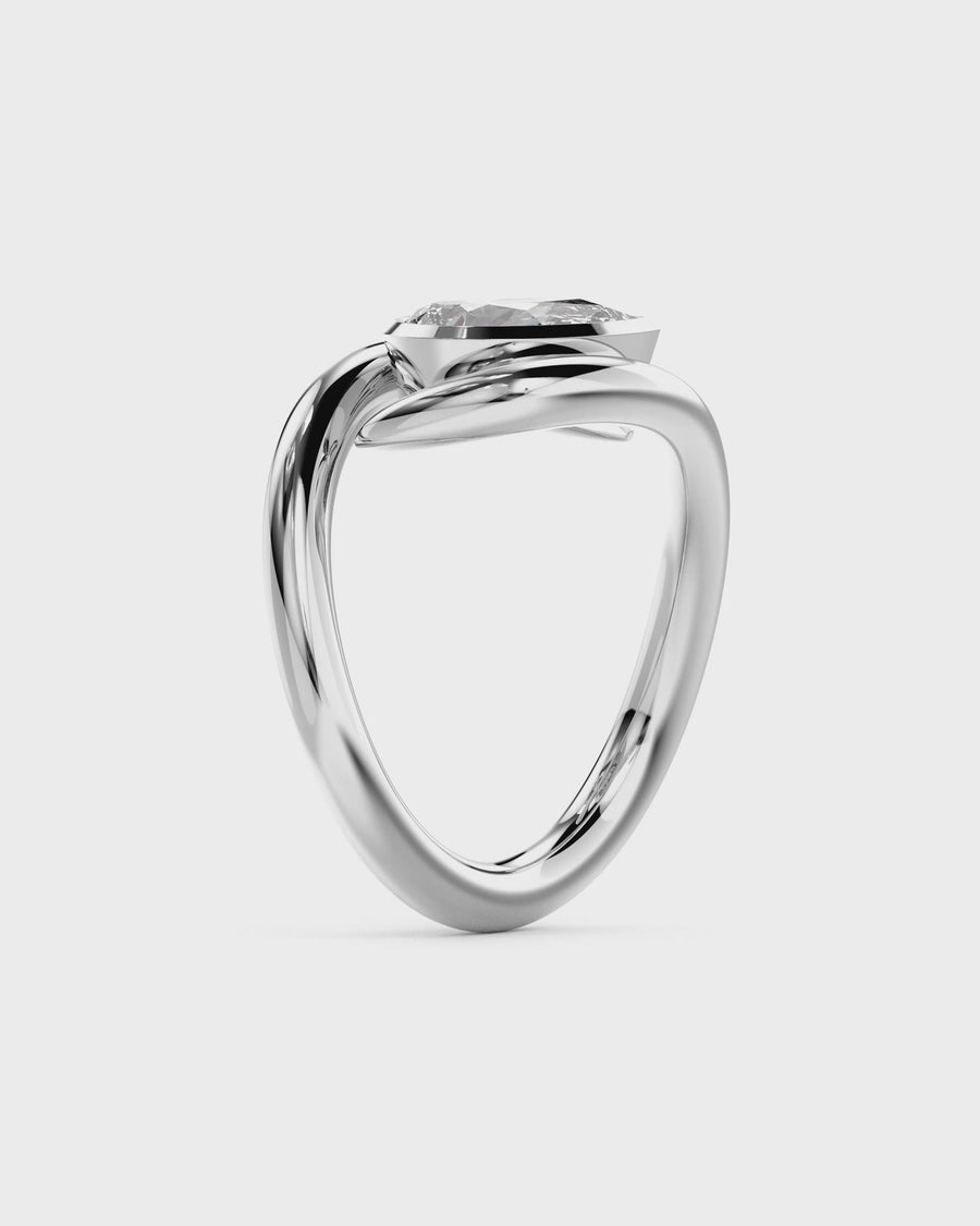 Video of unique pear-shaped diamond engagement ring with yellow gold bezel and sculpted white gold band Pruden and Smith