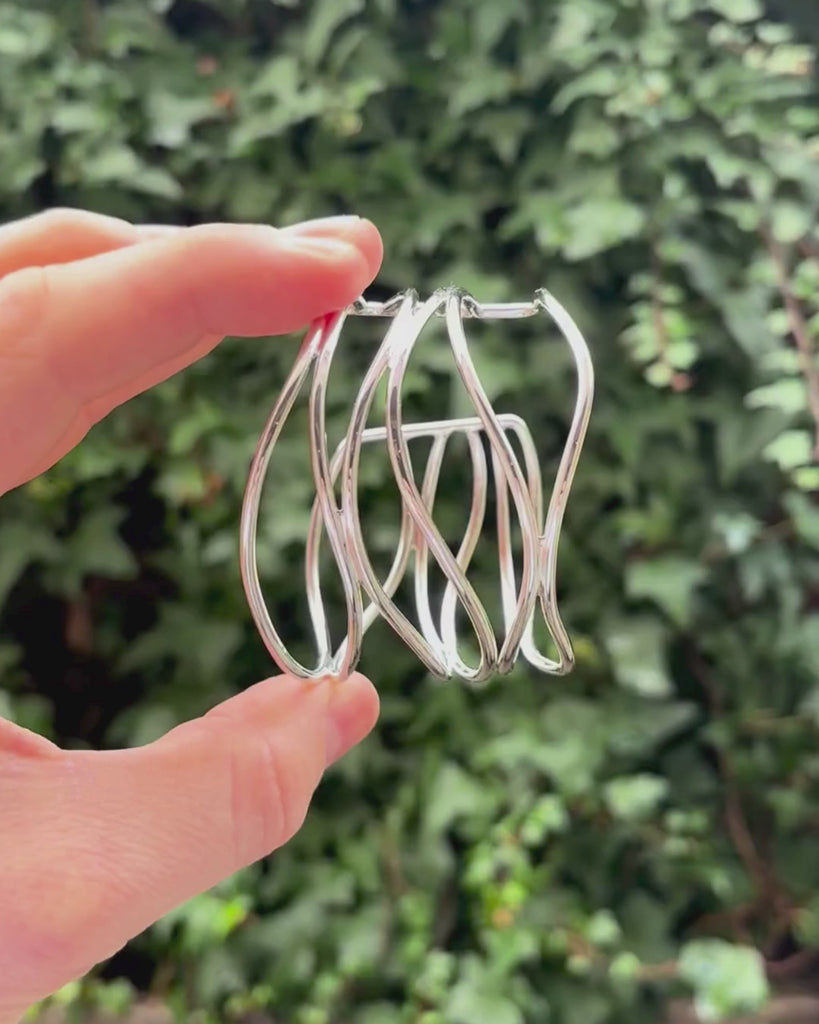 silver bangle being held