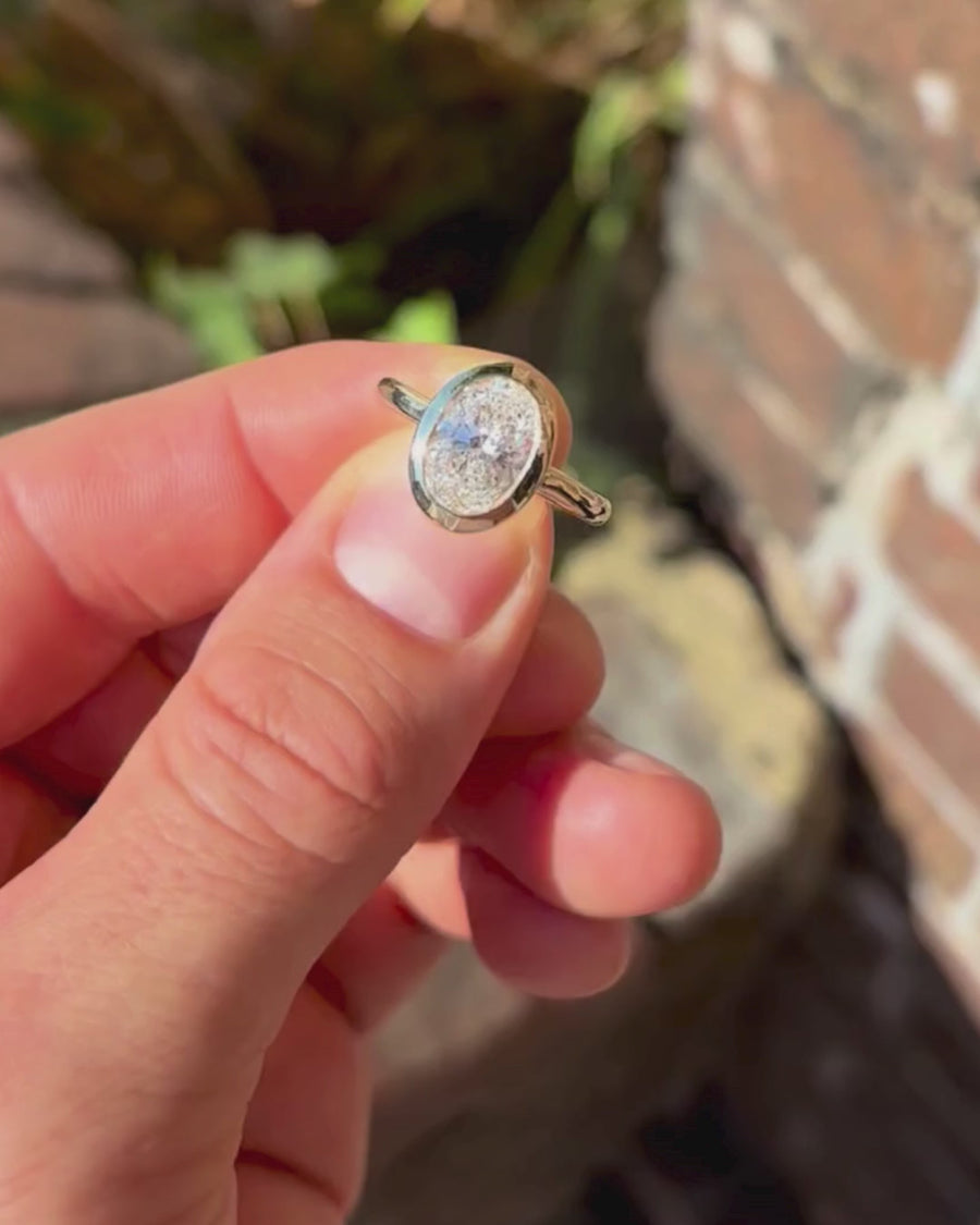 Oval Cut Bezel Cathedral Engagement Ring