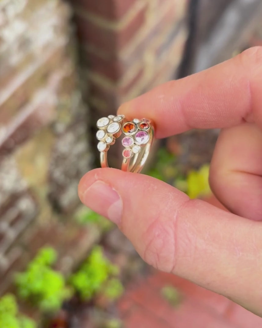 bubble rings in yellow gold rotating by hand