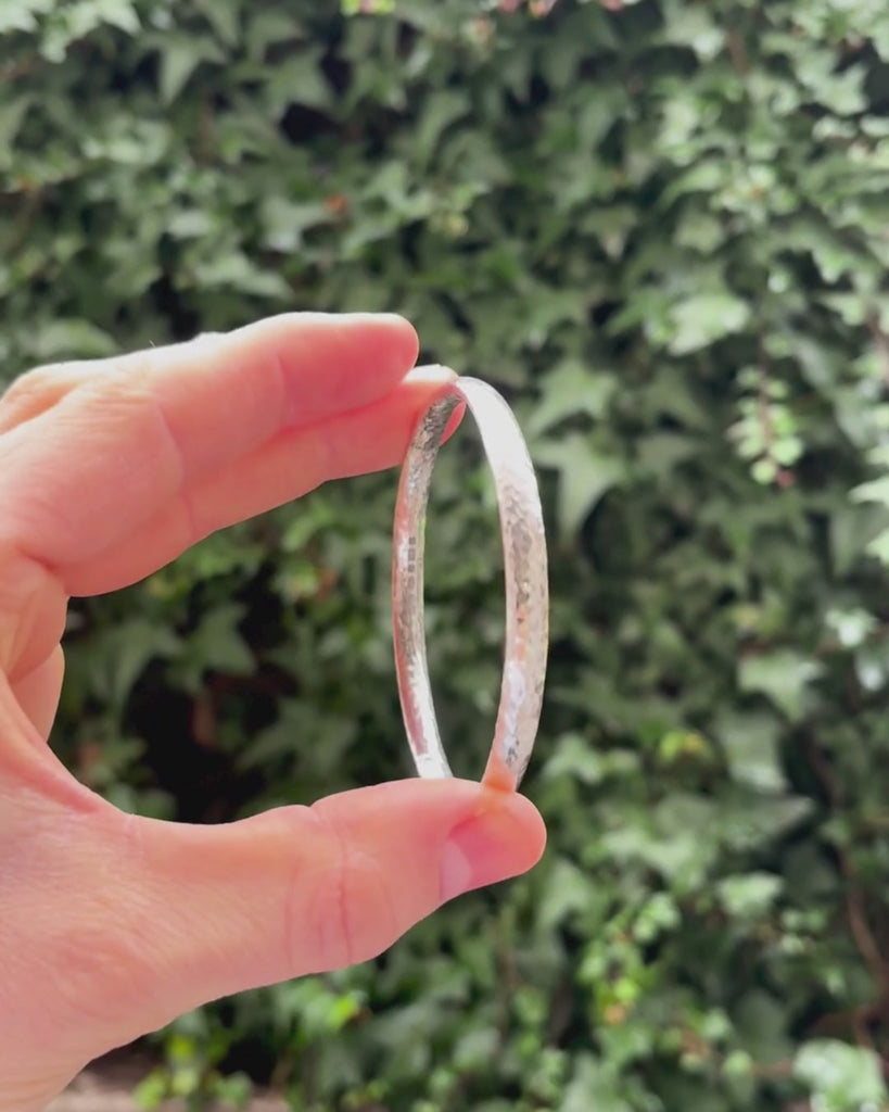 hammered solid silver bangle rotating by hand
