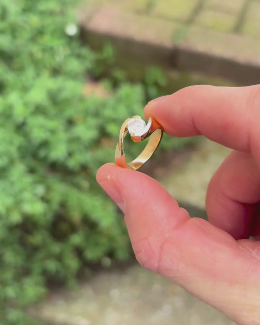 flat twist engagement ring rotating by hand