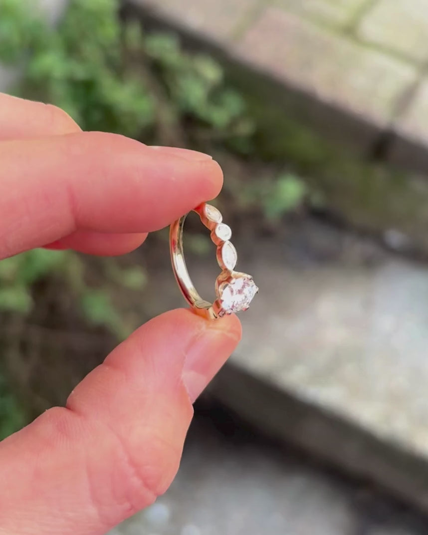 Yellow gold engagement ring being rotated