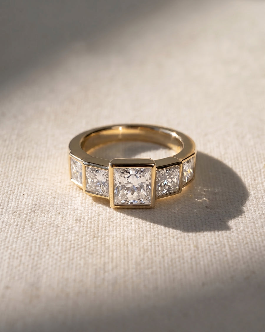 18ct yellow gold ring with five princess cut lab grown diamonds.