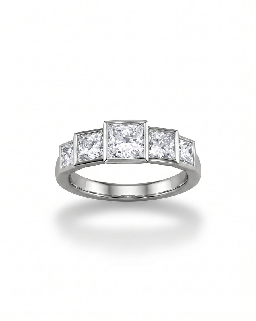 Silver ring with five princess-cut diamonds.