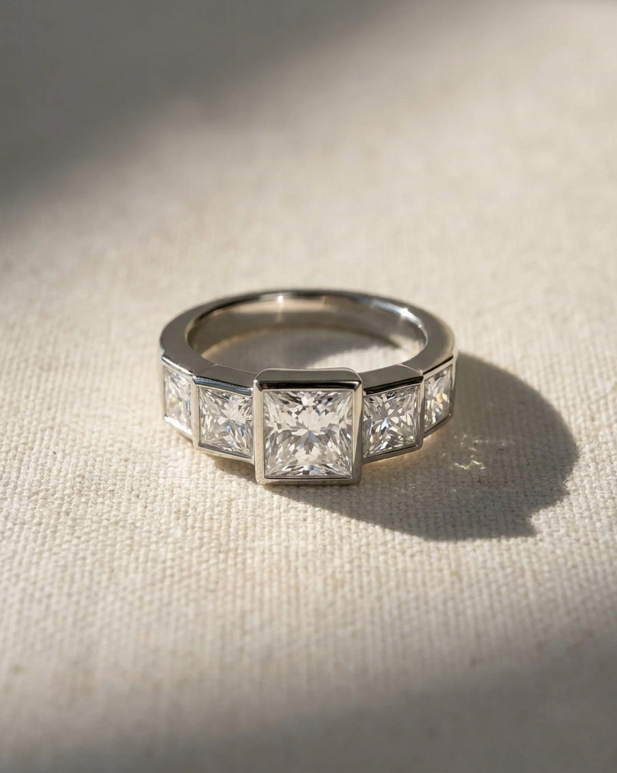 Platinum princess cut five diamond engagement ring.