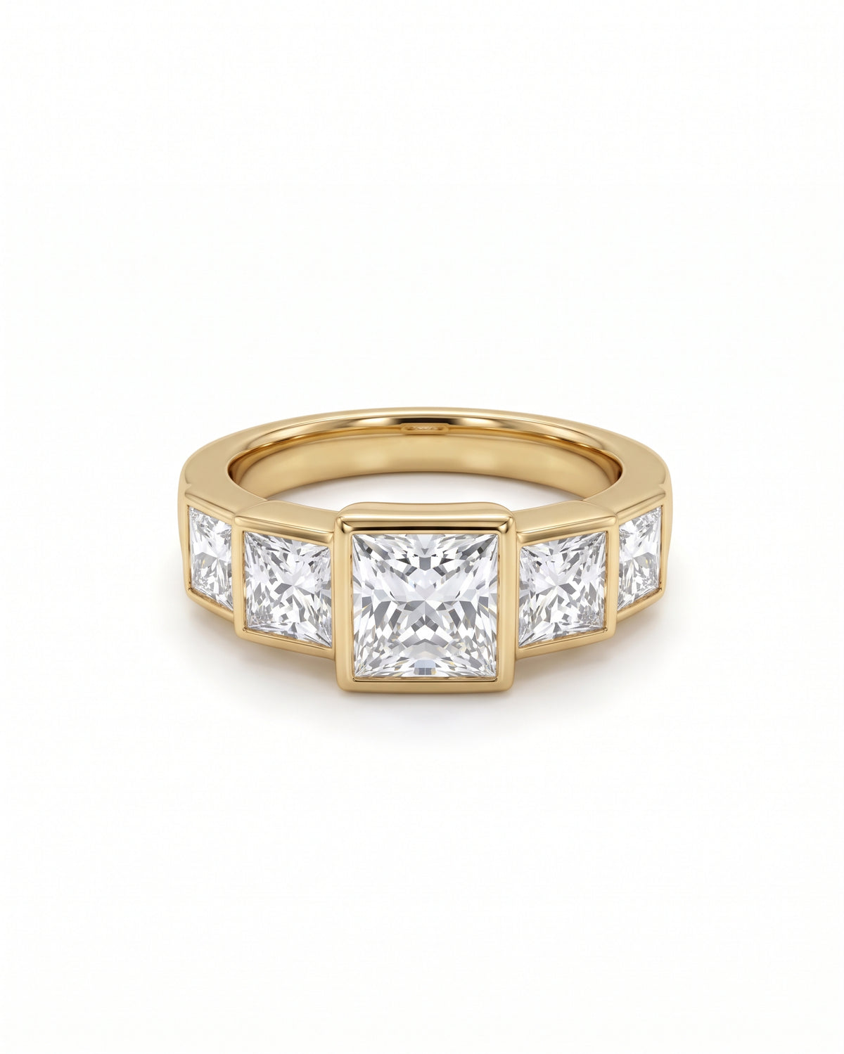 Five princess cut diamonds set in a yellow gold band with a bezel setting.