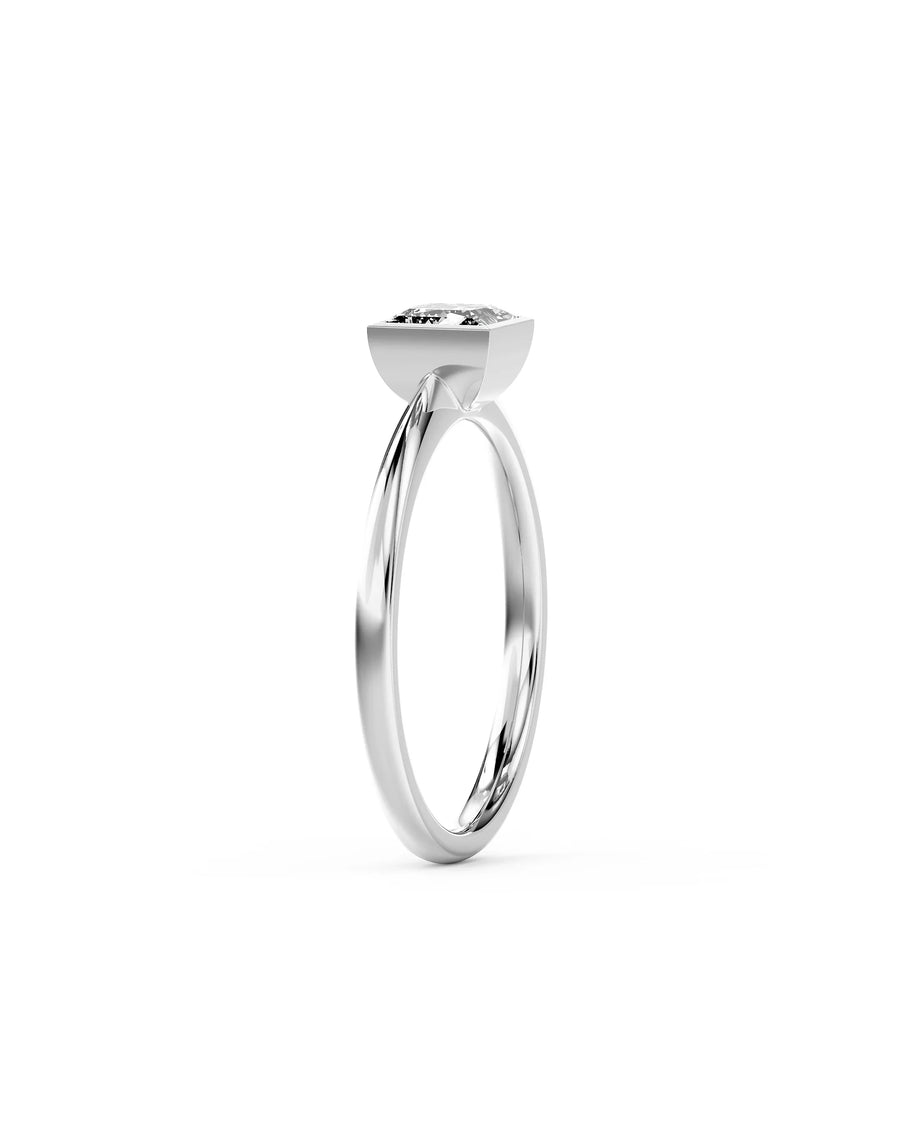 Silver princess cut bezel engagement ring.